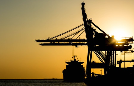 Silhouette of COntainer Cargo and Crane Bridge