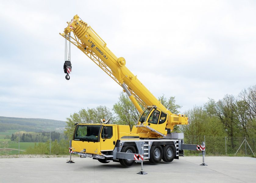 Hydraulic crane on construction site